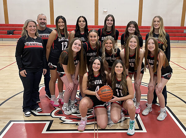Here are the players and coaches for the Santiam High girls basketball squad. The Wolverines are making a strong surge as the league and state playoffs get closer. Coach Hannah Thompson is at far right in the second row. Submitted Photo.