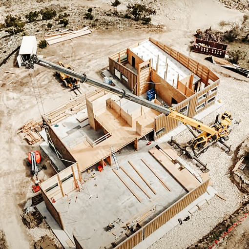 This is an overhead view of a house under construction in Dripping Springs, Texas, about a half hour from Austin. Freres Engineered Wood of Lyons produced every structural element to the building, including new, larger mass plywood panels. TimberBLDR