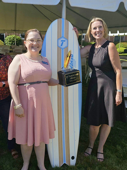 Melodie Weeks, left, shows off her Surfboard Award at the Friday, June 14, annual get-together of Santiam Hospital & Clinics’ Service Integration teams. At right is SIT coordinator Kim Dwer. SUBMITTED PHOTO